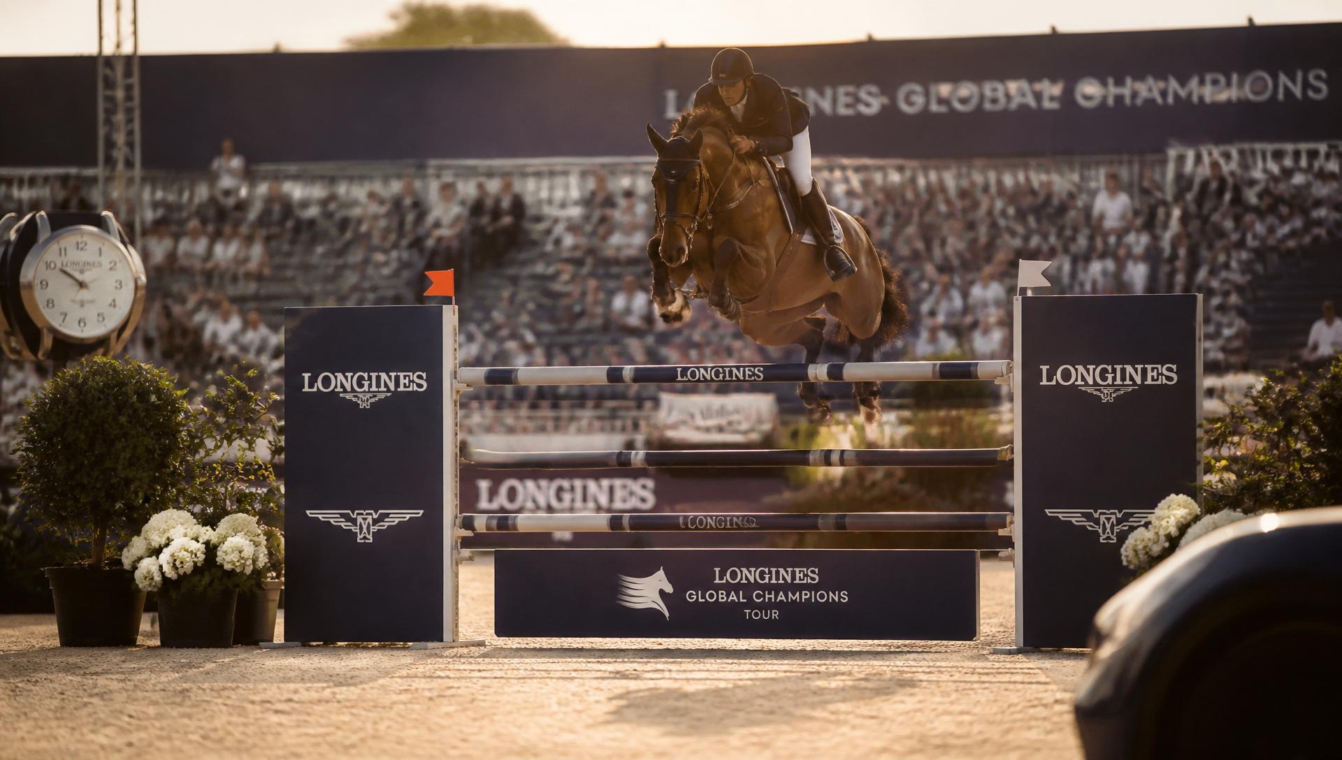 Elite showjumping horse and rider clearing a fence at a premium international event